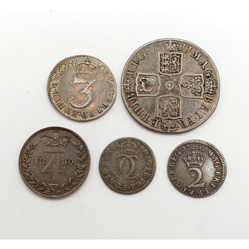 144 - A Queen Anne 2d Maundy coin, 1709, two other Queen Anne coins, and two further coins