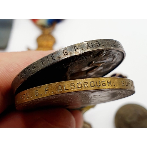 164 - A 1914-15 trio, awarded to 14484 Pte G F Alborough, Suffolk Regiment, a small group of badges, a Fre... 