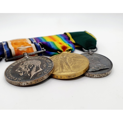 167 - A group of four medals, comprising a 1914-15 Star, a British War Medal, a Victory Medal, and a Terri... 