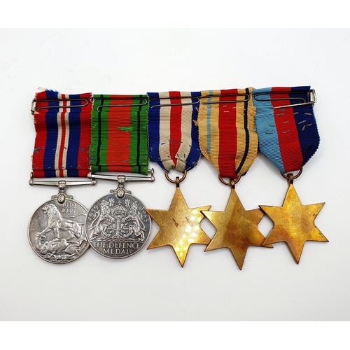 169 - A group of five medals, awarded to W G Davis, comprising a 1939-1945 Star, Africa Star, France and G... 