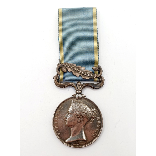 173 - A Crimea medal, named to Vinall RM, with a Sebastopol clasp