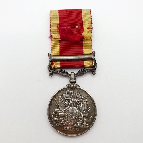 187 - A China Medal, unnamed, with a Canton 1857 clasp