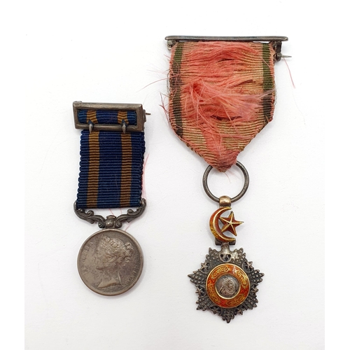 211 - An Order of Medjidie miniature, slight loss to the enamel, and a Punjab Medal miniature (2)