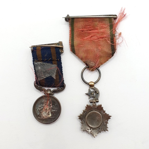 211 - An Order of Medjidie miniature, slight loss to the enamel, and a Punjab Medal miniature (2)