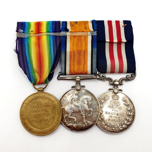 214 - A trio of medals, comprising a Military Medal, and a pair of WWI medals, awarded to 20016 L Sgt T Tr... 