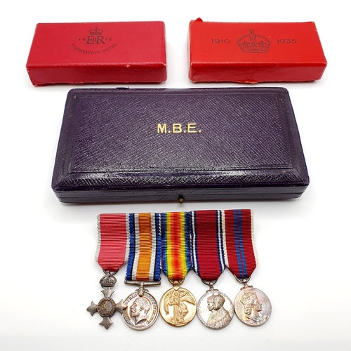 258 - An MBE, an Elizabeth II Coronation Medal, a George V Silver Jubilee Medal, all boxed, and a group of... 