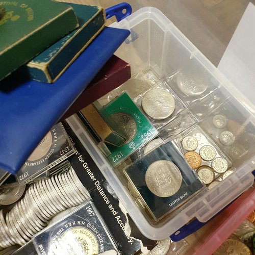 127 - A large group of commemorative crowns, other coins, and an album of world stamps