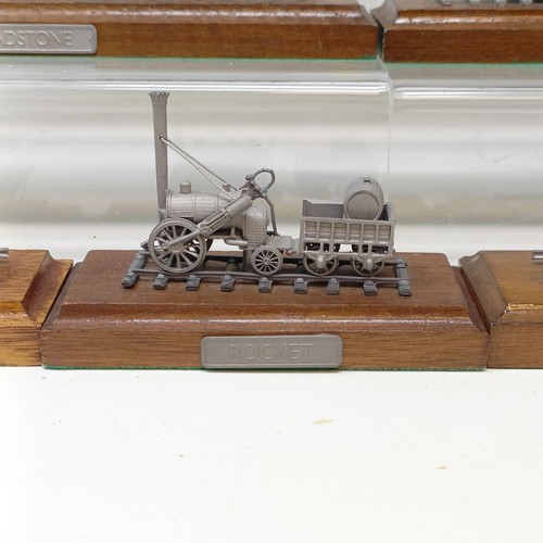 407 - A Danbury Mint pewter model of the Evening Star locomotive and tender, on a wooden base, assorted ot... 