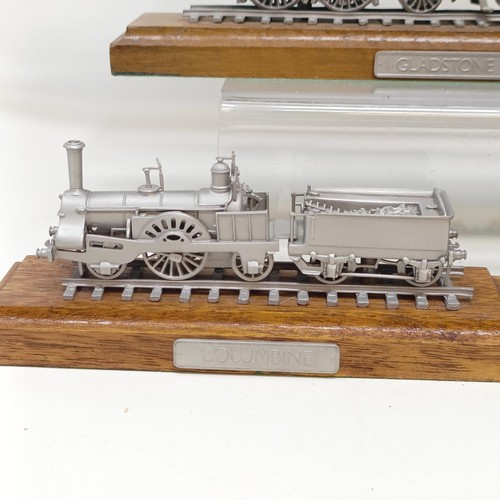 407 - A Danbury Mint pewter model of the Evening Star locomotive and tender, on a wooden base, assorted ot... 