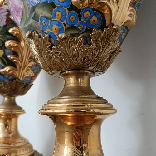 300 - A large pair Continental porcelain vases and covers, decorated birds and flowers, with gilt handles ... 