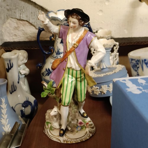 313 - A Dresden figure of a man, with a sheep, 20 cm high, a Chinese blue and white two handled vase, 13 c... 