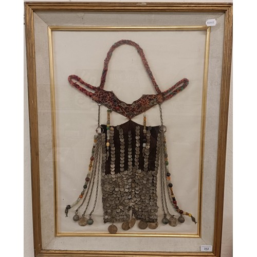 332 - A tribal necklace, framed, 60 x 38 cm approx.