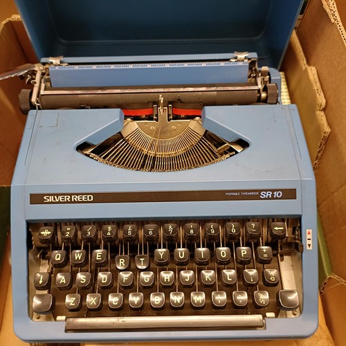 347 - A typewriter, a collectors plate, a child's gas mask, and assorted other items (box)