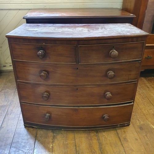 527 - A mahogany chest, having two short and three long drawers, 117 cm wide, and a mahogany bow front che... 