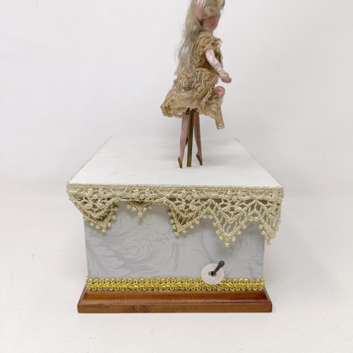 351 - A 19th century style music box, with two dancing figures, 17 cm wide