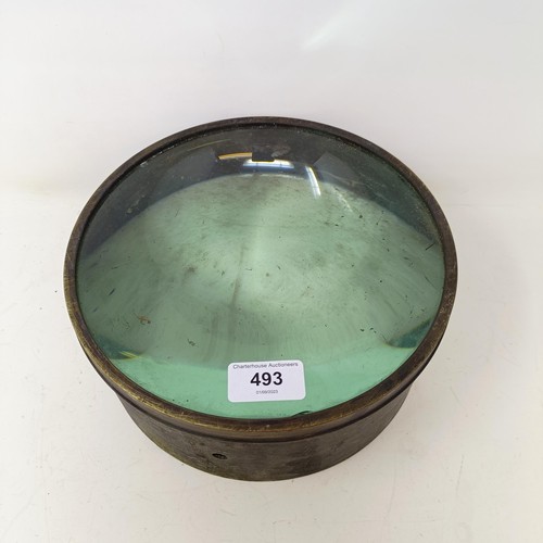 493 - A late 19th/early 20th century table top magnifying glass, in a brass frame, 23 cm diameter x 9.5 cm... 