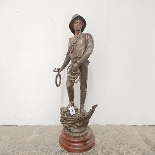 349 - A large French spelter figure, Le Secours, on a simulated marble base, 68 cm high