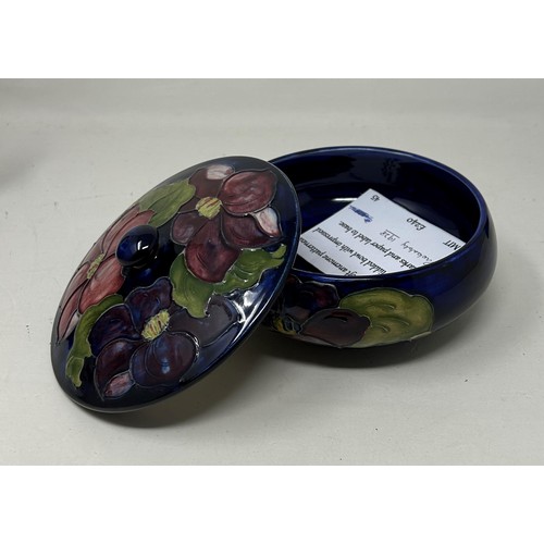 398 - A Moorcroft Pottery bowl and cover, decorated flowers, 14 cm diameter