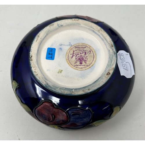 398 - A Moorcroft Pottery bowl and cover, decorated flowers, 14 cm diameter