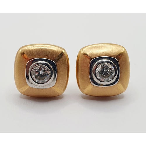 909 - A pair of Boodles Amare 18ct gold, platinum and diamond set ear studs