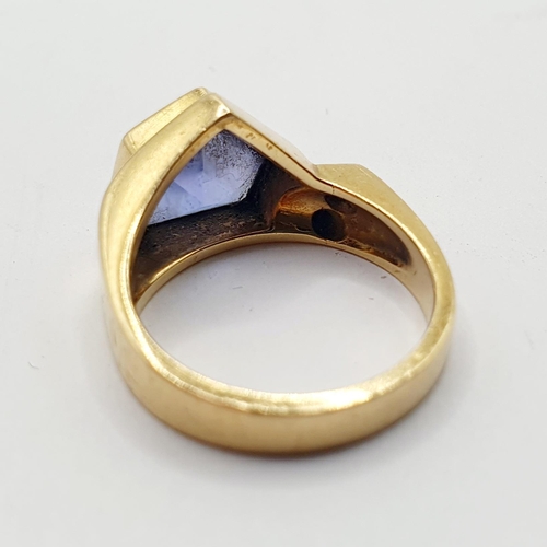 794 - An 18ct gold, blue tanzanite and diamond ring, ring size H