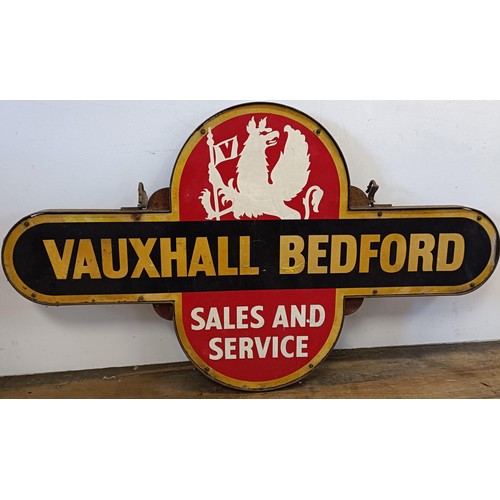 1043 - A Vauxhall Bedford Sales and Service target style double sided enamel sign, in a metal frame with ho... 