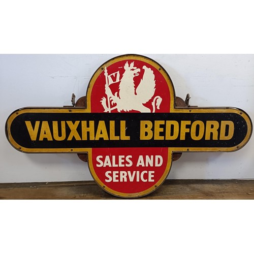 1043 - A Vauxhall Bedford Sales and Service target style double sided enamel sign, in a metal frame with ho... 