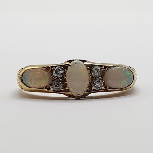 834 - An 18ct gold, opal and diamond ring, ring size M