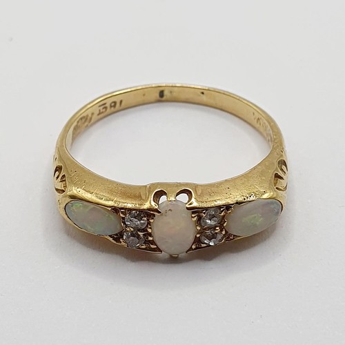 834 - An 18ct gold, opal and diamond ring, ring size M