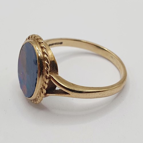 895 - A yellow coloured metal and opal doublet ring, ring size S 1/2