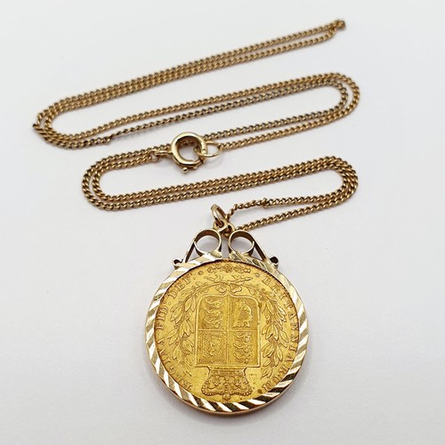 879 - A Victorian gold shield back sovereign, 1842, in a 9ct gold mount and chain