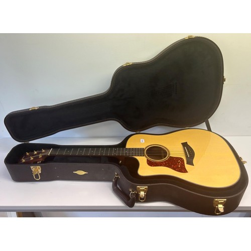 472 - A Taylors guitar, Model 710-CE, Serial No 20050321129, in a hard carry case