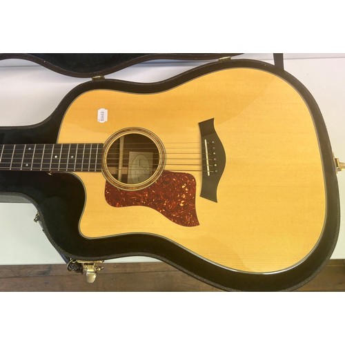 472 - A Taylors guitar, Model 710-CE, Serial No 20050321129, in a hard carry case