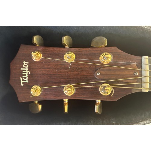 472 - A Taylors guitar, Model 710-CE, Serial No 20050321129, in a hard carry case