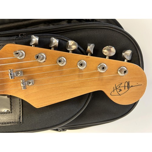 474 - A copy of a Fender Stratocaster guitar, in a soft carry case