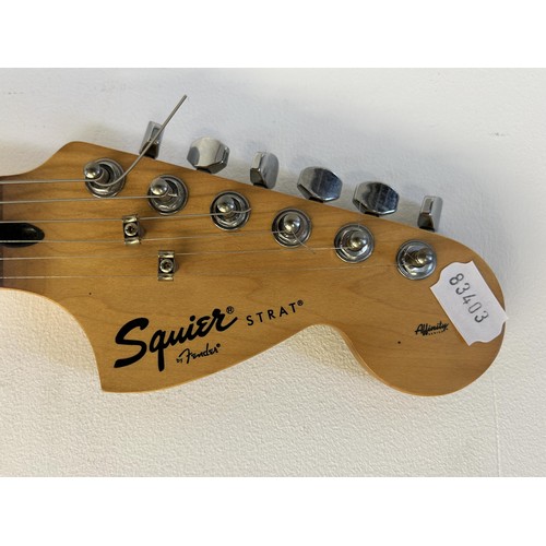 480 - A Squire Fender Stratocaster electric guitar, and stand