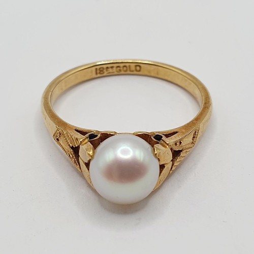 753 - An 18ct gold and cultured pearl ring, ring size J