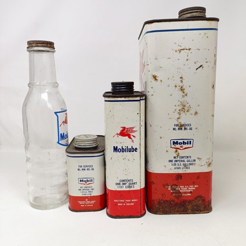 1001 - A Mobiloil Vacuum oil glass bottle, two Mobiloil cans, and a Mobilube can (4)