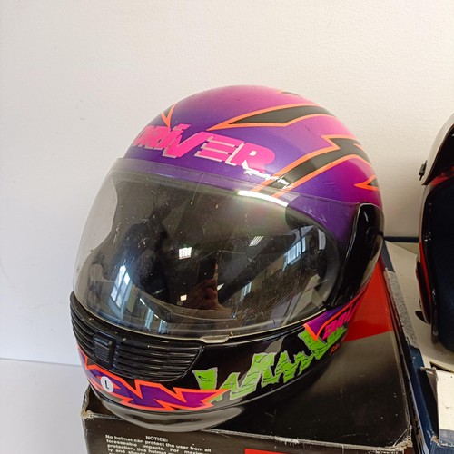 1069 - An Axo RX-5 motorcross helmet, XL 62-7 5/8, and Arai MX-3 motorcycle helmet, and another helmet (3)