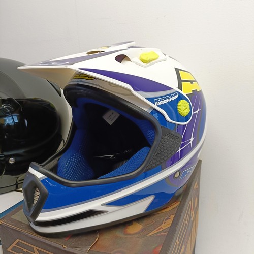 1069 - An Axo RX-5 motorcross helmet, XL 62-7 5/8, and Arai MX-3 motorcycle helmet, and another helmet (3)