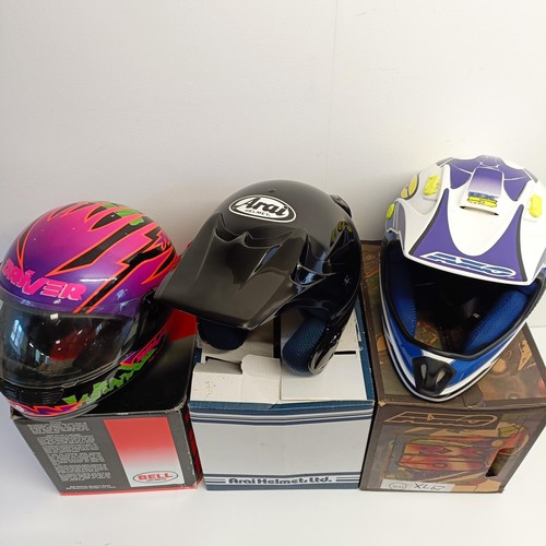 1069 - An Axo RX-5 motorcross helmet, XL 62-7 5/8, and Arai MX-3 motorcycle helmet, and another helmet (3)