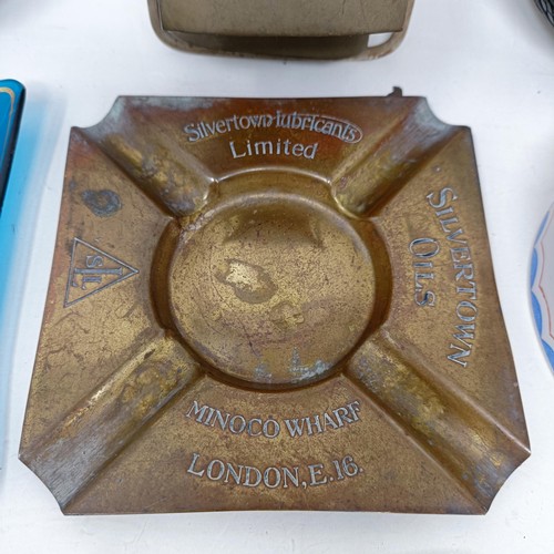 1132 - A Silvertown Oils brass ashtray, a Regent Ethyl glass ashtray, four other vehicle related ashtrays a... 