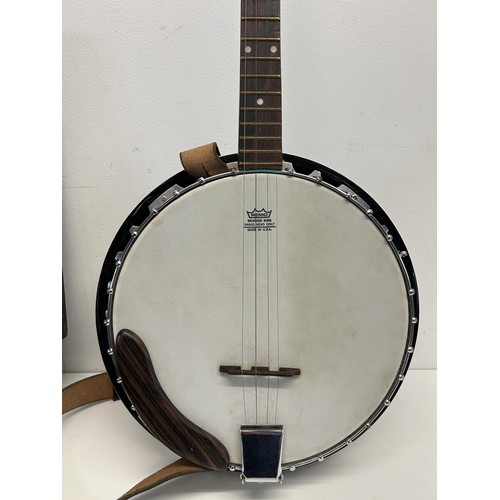 482 - A Lorenzo banjo, cased