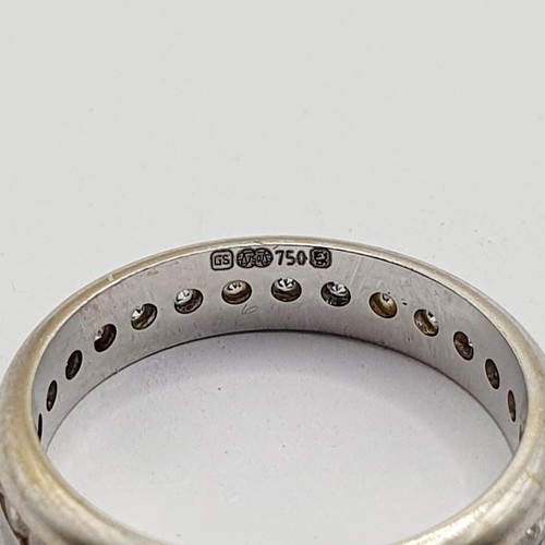 839 - An 18ct white gold and diamond eternity ring, ring size N