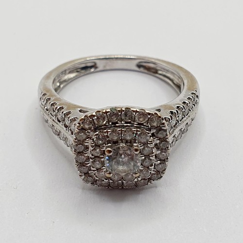 851 - An 18ct white gold and diamond cluster ring, ring size I