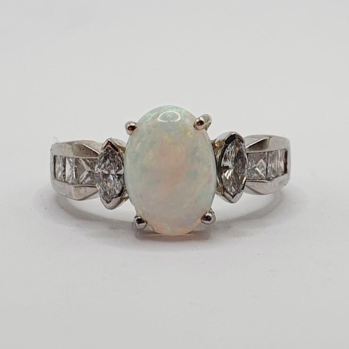 764 - An 18ct white gold, diamond and opal ring, ring size N