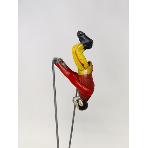 1567 - A tinplate acrobatic monkey, and a wire and fur monkey