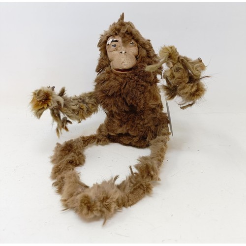 1567 - A tinplate acrobatic monkey, and a wire and fur monkey