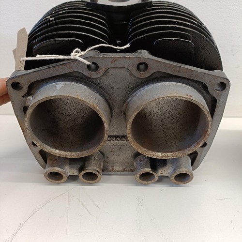 1189 - A motorcycle cylinder head, and two other bike parts (3)