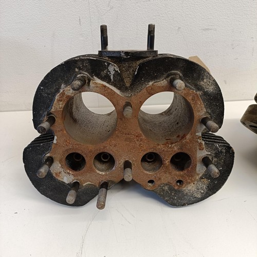 1189 - A motorcycle cylinder head, and two other bike parts (3)